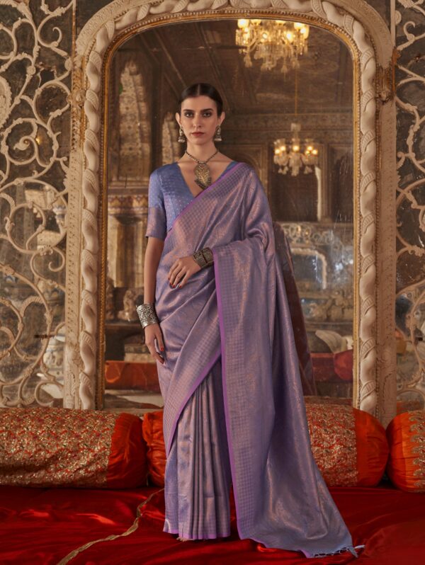 Regal Amethyst Lavender Silk Saree with silver zari weaving and antique jewelry styling in a heritage palace background.